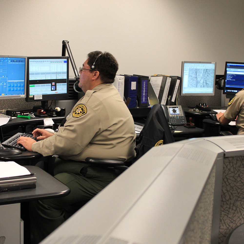 Police officers working at desks